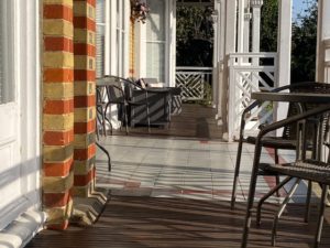 Veranda spanning the front.